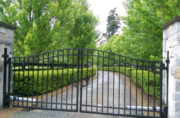 Residential driveway gate with custom iron antler design