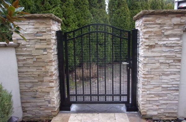 Residential Pedestrian Swing Gate With Stacked Stone Pillars