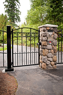 Pedestrian Gate Mounted to River Rock Column
