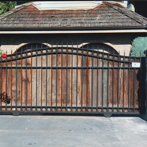 Iron Slide Gate with Arch and Wood Applique