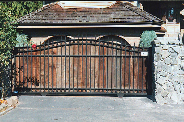 Iron Slide Gate with Arch and Wood Applique