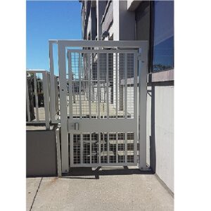 Commercial iron pedestrian gate; white