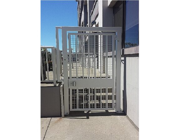 Commercial iron pedestrian gate; white