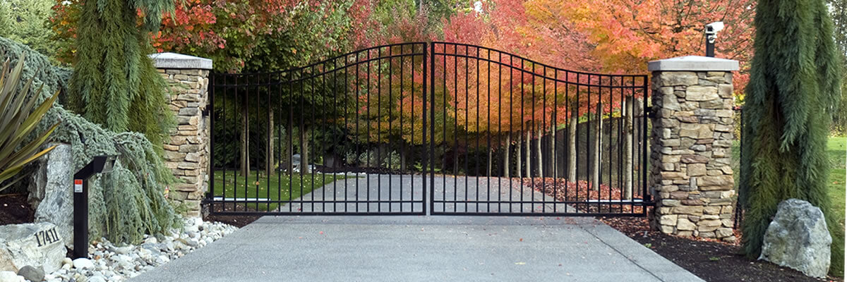 Residential Arched Double Swing Gate With Pillar-Mounted Camera For Extra Security