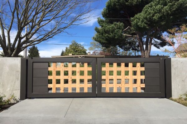 Residential Modern, Double Swing, Metal And Wood Gate With Surrounding Concrete Wall