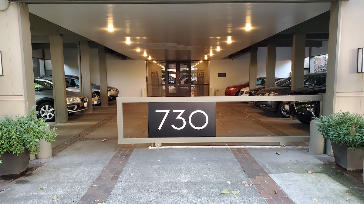 A Sliding Automatic Gate Featuring The Building Address Helps Guests To Find The Entrance