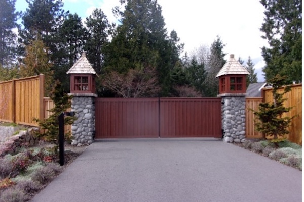 Wood Wrapped Automated Swing Gate System With Custom Masonry Pillars