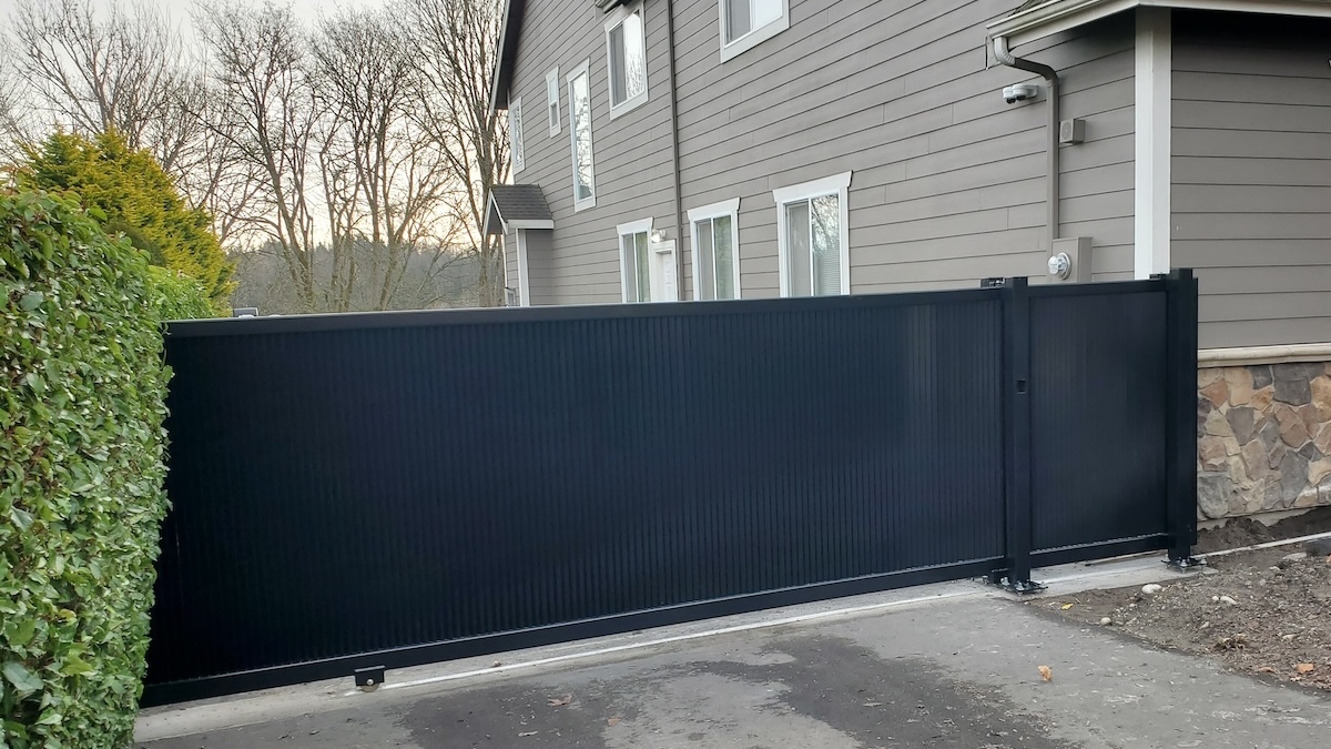 Residential Driveway Louvered Gate Residential Driveway Louvered Metal Slide Gate Appears Solid But Allows Wind To Pass