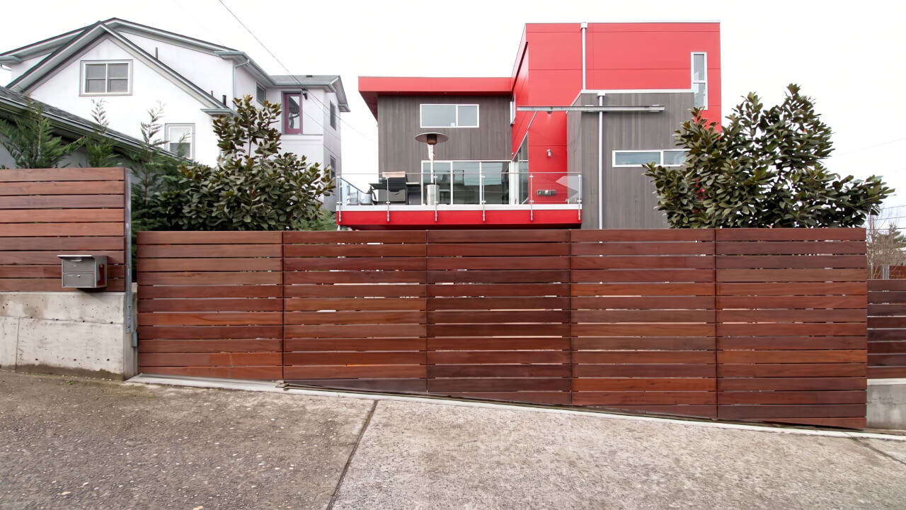 Automated iron and wood slide gate in Seattle.