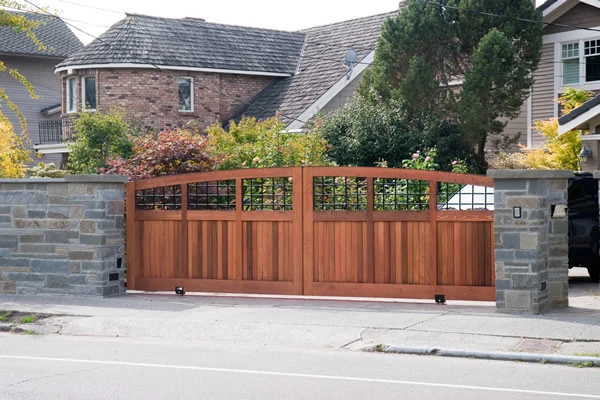 Residential Slide Gate Iron and wood two-panel slide gate at a Seattle home.